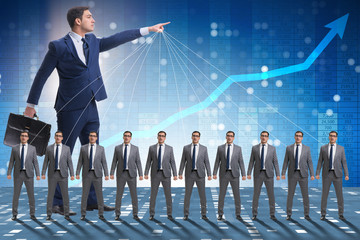 Boss employee manipulating his staff in business concept