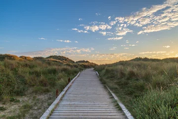 Peel and stick wall murals A wooden pathway leading towards the sea at Formby in Merseyside, taken at sunset