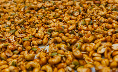 Macro Closeup of Seasoned Mixed Nuts and Seeds on a Baking Tray