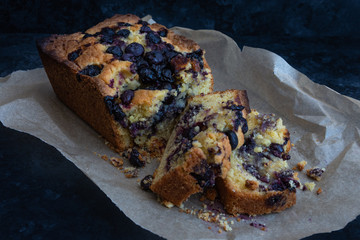 Blueberry Loaf Cake in brown paper