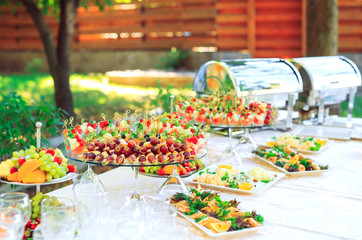 Background of party appetizers on wooden sticks