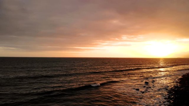 Ocean during sunset. Coast, sky, water, sun
