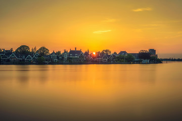Fototapeta na wymiar Sunset above the beautiful village of Zaanse Schans in Holland