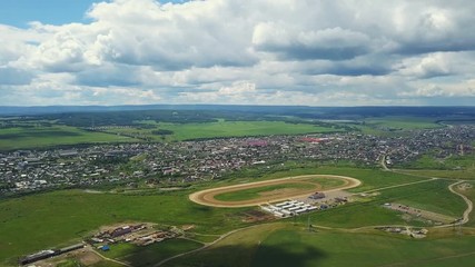 Aerial drone shot of the city on the fields