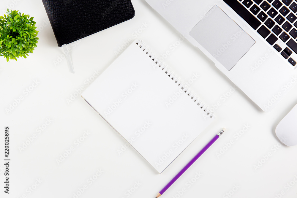 Poster top view of laptop computer,, diary and mouse and notepad, glasses and pencil isolated on white back