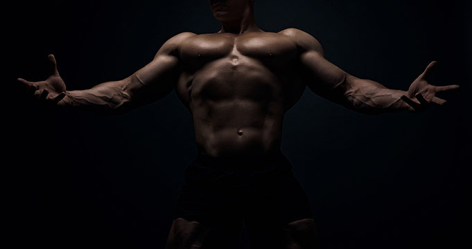 Muscular Bodybuilder Guy Doing Exercises