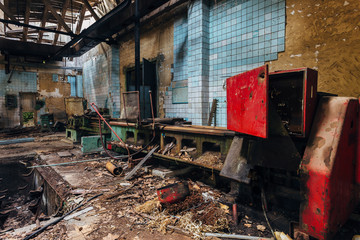 Old industrial machine tools in workshop. Rusty metal equipment in abandoned factory