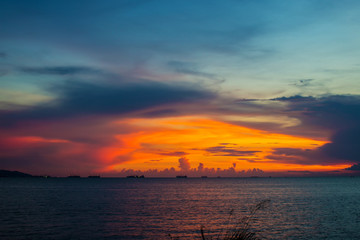 Obraz na płótnie Canvas Twilight sky background. Colorful Sunset sky and cloud.vivid sky in twilight time background.Fiery orange sunset sky. Beautiful