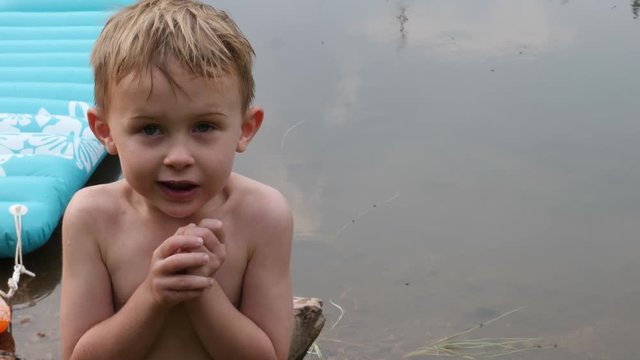 Cute young child being cold in front of the camera.