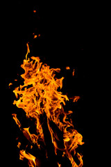 Flame of fire with sparks on a black background
