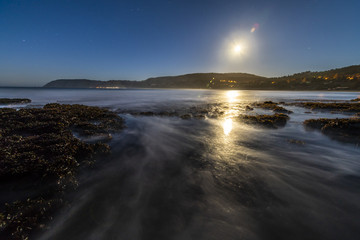 A full moon illuminated landscape at Puertecillo Beach close to Santiago de Chile an amazing place for surf and enjoy at the beach, Chile