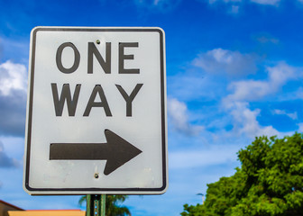 Close up of an one way sign