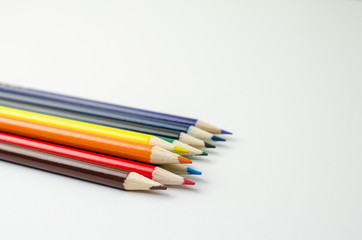 Close up of a set of co-lour pencil in white background