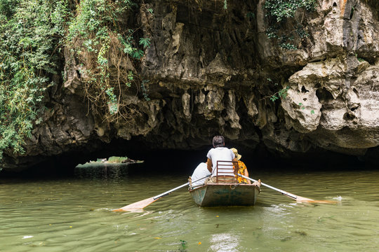 Boat ride from Vung Tram Pier. Traditional paddle-boat trip lets the tourists truly appreciate the serenity and beauty of nature along the Ngo Dong River, the grottoes and limestone karsts of Tam Coc.