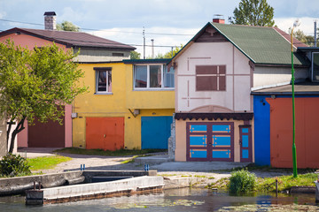 Fototapeta na wymiar multicolored slipways on the river bank