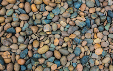 Sea pebbles. Small stones gravel texture background.Pile of pebbles, thailand.Color stone in background.