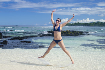 Woman jumping on a beach