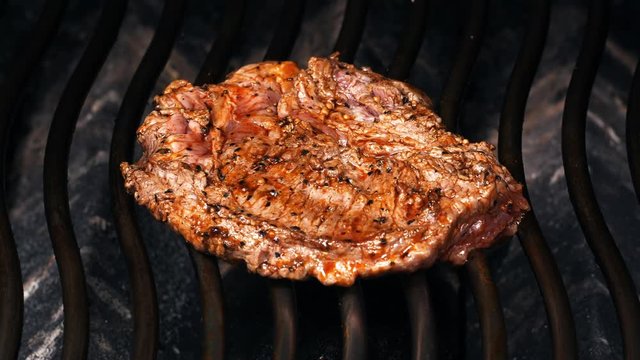UHD shot of juicy Mexican style marinated beef steak on the grill