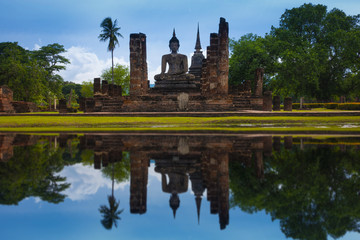 Fototapeta na wymiar Old heritage busshist temple in Sukhothai Historical Park in Thailand.