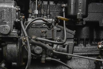 Background surface of old, black and oily machine engine