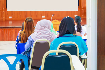 Business women in education seminar training conference in interior meeting room