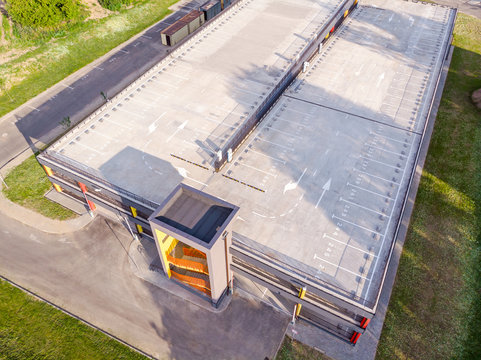 modern multilevel car parking building in residential area. aerial view