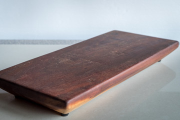 wooden cutting board on white bright surface ideal for food blog restaurant menus cooking book or recipe background 