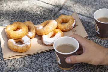 Doughnuts with sugar powder and coffee. Street food