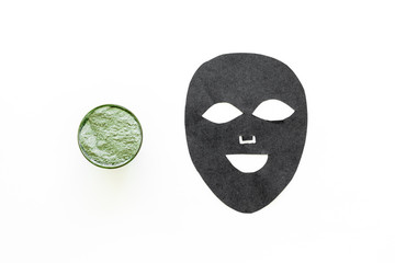 Black facial mask. Black head remover mask. Mask with clay on white background top view copy space