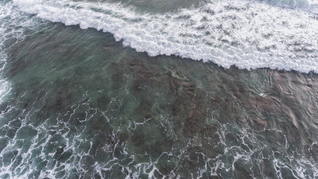 Aerial beach wave on tropical sea