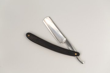 Sharp straight razor on white background. Vintage razor