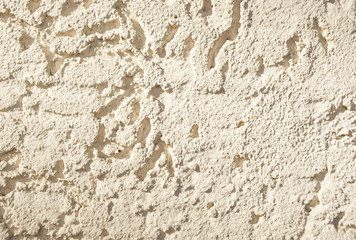 Old cracked white concrete wall. Textured background.