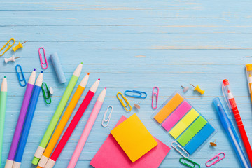 school supplies on  blue wooden background