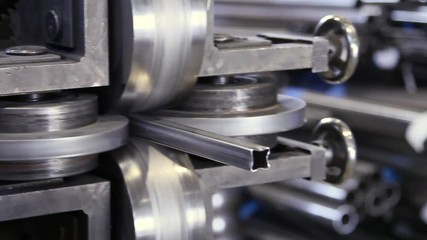 Metal-rolling machines for production of stainless steel profile in tfactory. High-quality rolled metal in industrial production is used for manufacture of parts or an independent element.