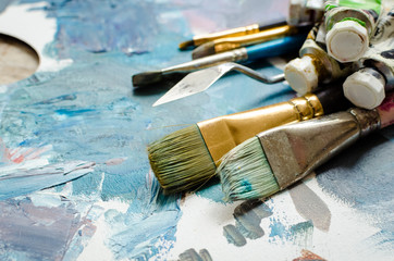 Artist paint brushes and oil paint tubes