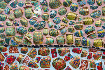  pattern and color of the decorated benjarong on the wall.