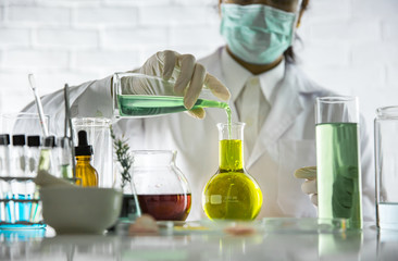 Beauty background, scientist is sampling a chemical extract from organic natural, research and...
