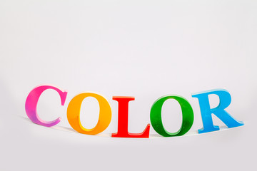 colorful character of the word color in white background with copy space