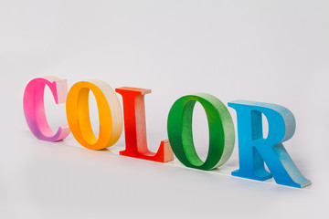 colorful character of the word color in white background with copy space