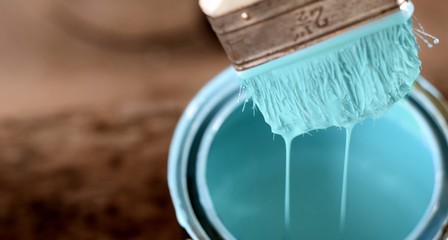 ocean blue paint  brush on color can on old rustic  wood background,DIY handmade concept