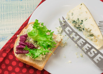 Vegetarian sandwich with salad and blue cheese on a wooden background. Healthy Diet