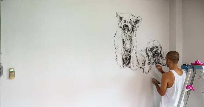 Timelapse of artist painting group of dogs with rabbit, black and white acrylic on gray cement wall background