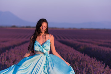 Fototapeta premium woman portrait in lavender flower field
