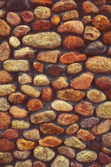 Wall lined with cobblestones, textured background