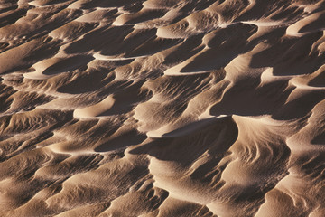 Fototapeta na wymiar Sand pattern, natural outdoor background