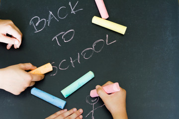 Back to school letters and drawing kids on blackboard 