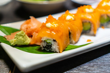Chopstick roll  salmon sashimi and shoyu soy sauce in japanese restaurant