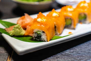 Chopstick roll  salmon sashimi and shoyu soy sauce in japanese restaurant