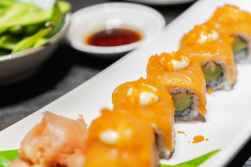 Chopstick roll  salmon sashimi and shoyu soy sauce in japanese restaurant
