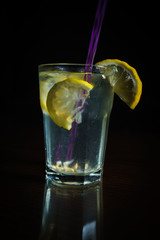 Fresh cocktail on a black background. Alcoholic cocktail on a black background. Fruit with a cocktail. Non-alcoholic cocktail. Mix of cocktails on a black background. 